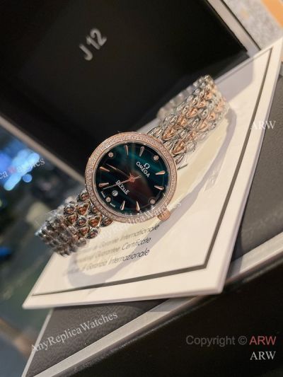 High Quality Replica Omega De Ville Prestige Shine Silver strap Green Face Dial White Diamonds Ceramic Bezel Lady Watch 28mm